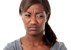 single black woman disgusted at male behavior